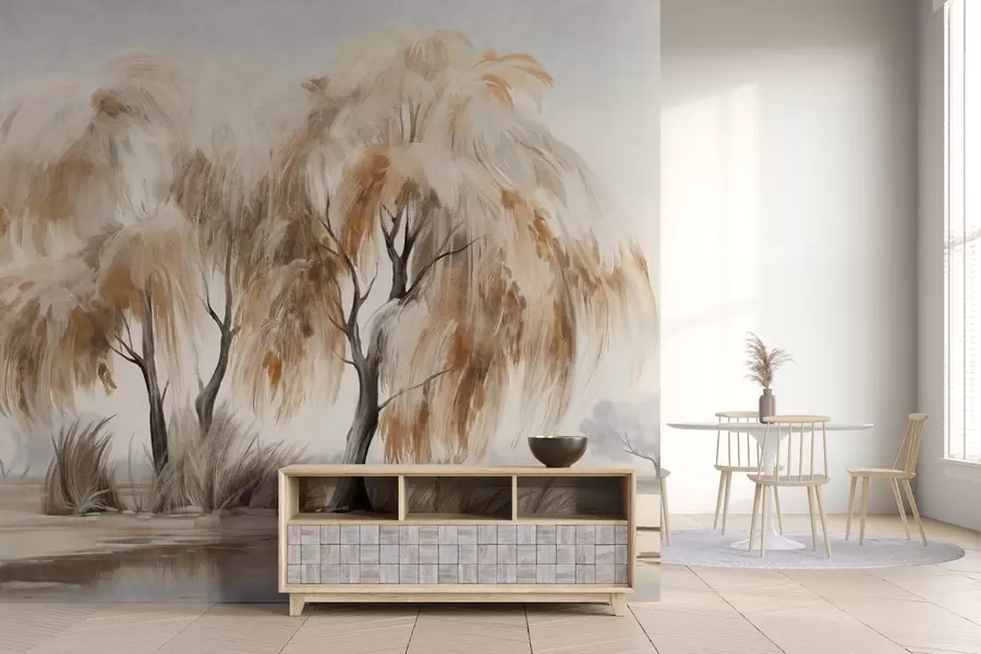 Carta da parati nature Salici strutturati con foglie bianche e marroni sulla riva di un lago, con dell'erba intorno, in una giornata nebbiosa 