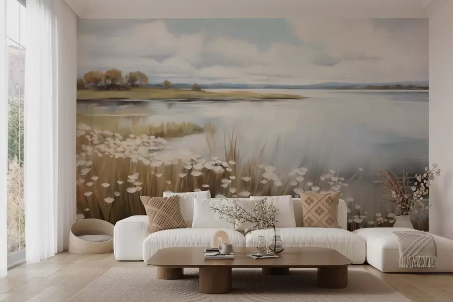 Carta da parati nature Paesaggio strutturato, campo di fiori bianchi ed erba alta, un lago sullo sfondo, una collina erbosa con alberi, colori tenui 