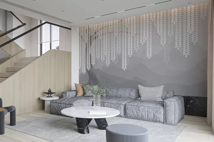 Carta da parati nature salice stilizzato con foglie pendenti su uno sfondo di montagne minimaliste nei toni del grigio 